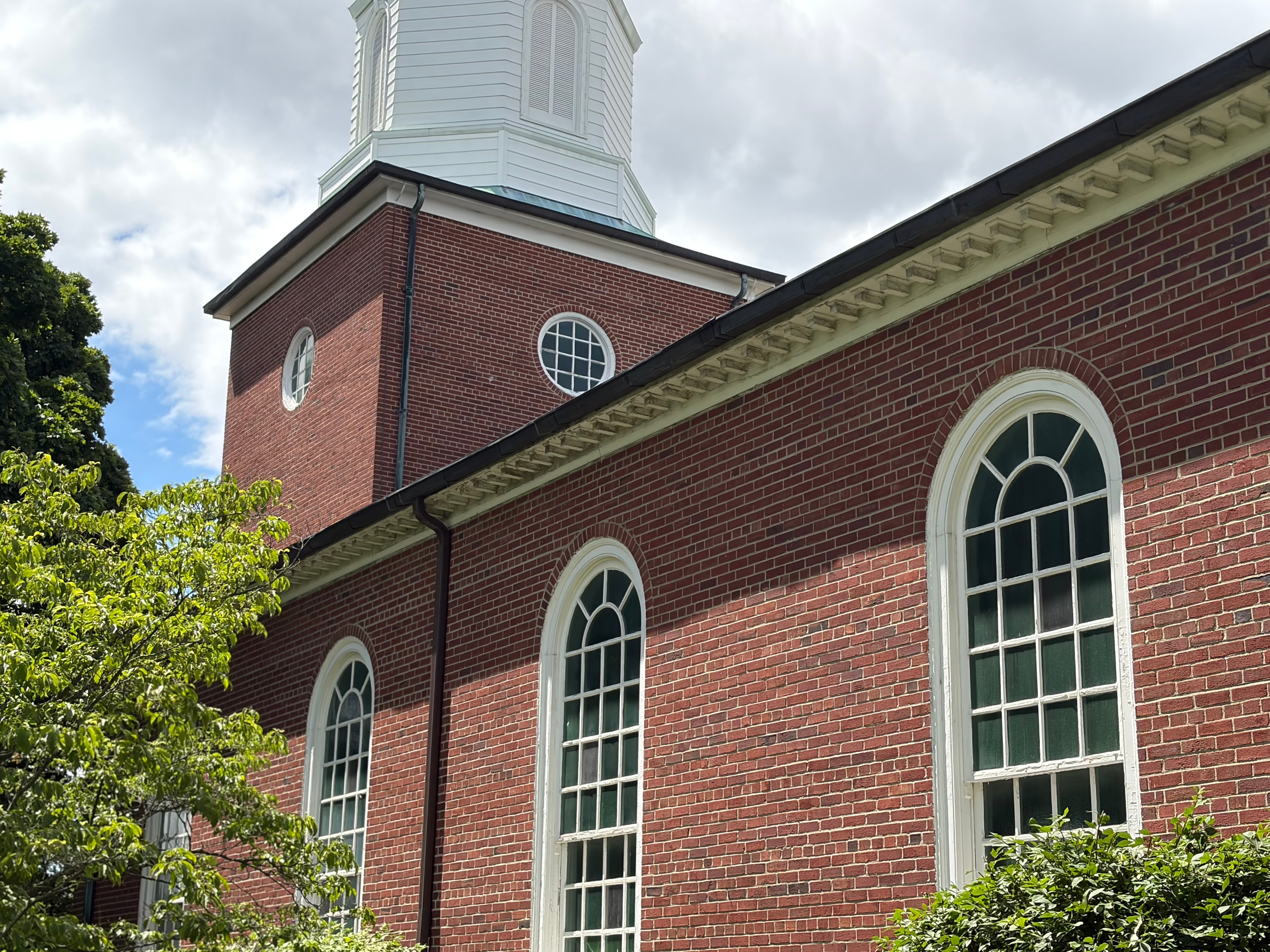 Copper gutter system on brick church showing soffit and fascia detail